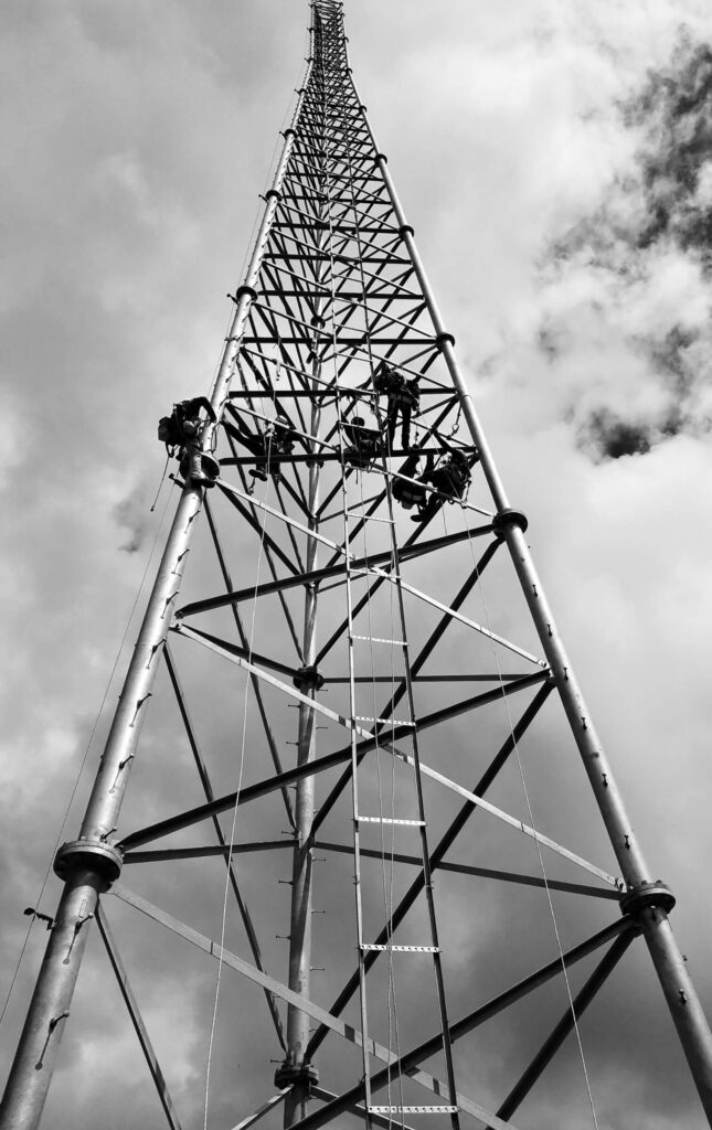 Speakeasy Telecommunications working on communication towers in Driftwood, Texas